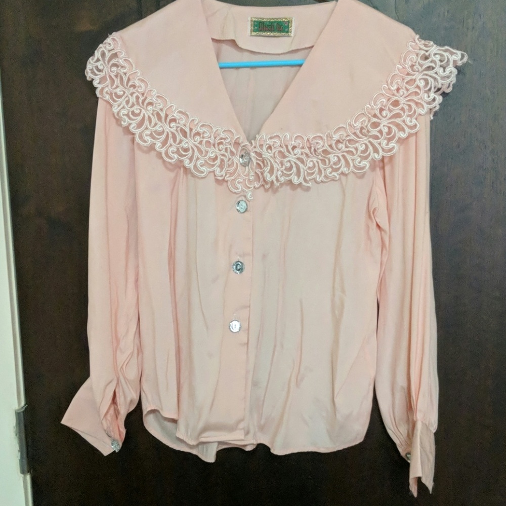 A vintage pink button down shirts